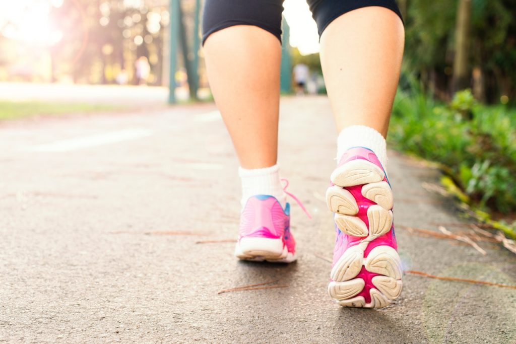 lower legs with pink trainers - Benefits of walking on a treadmill